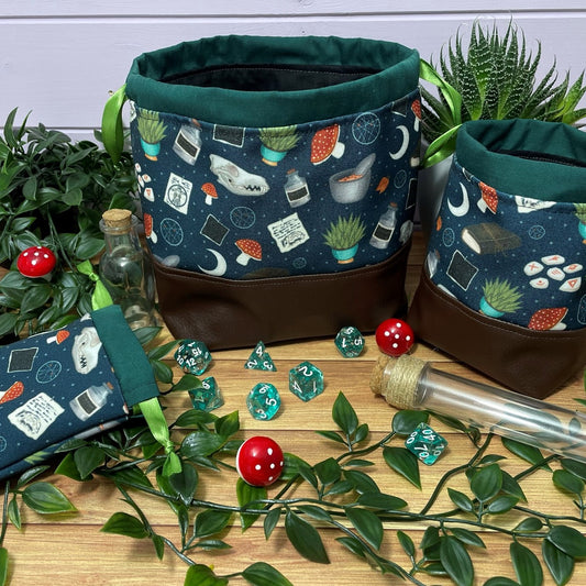 druid themed dice bags feature mushrooms, skulls, plants and runes in shades of greens and blues